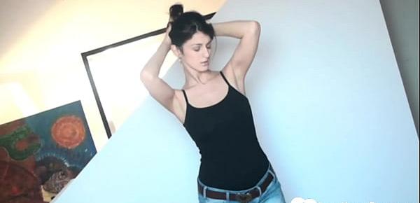 Brunette pleasuring her wet cunt on a mat